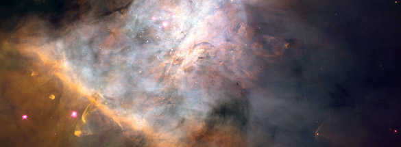 This spectacular, 2.5 light-years-wide-view, color panorama of the center of the Orion nebula reveals at least 153 glowing protoplanetary disks that are believed to be embryonic solar systems that will eventually form planets. (copyright GRIN)